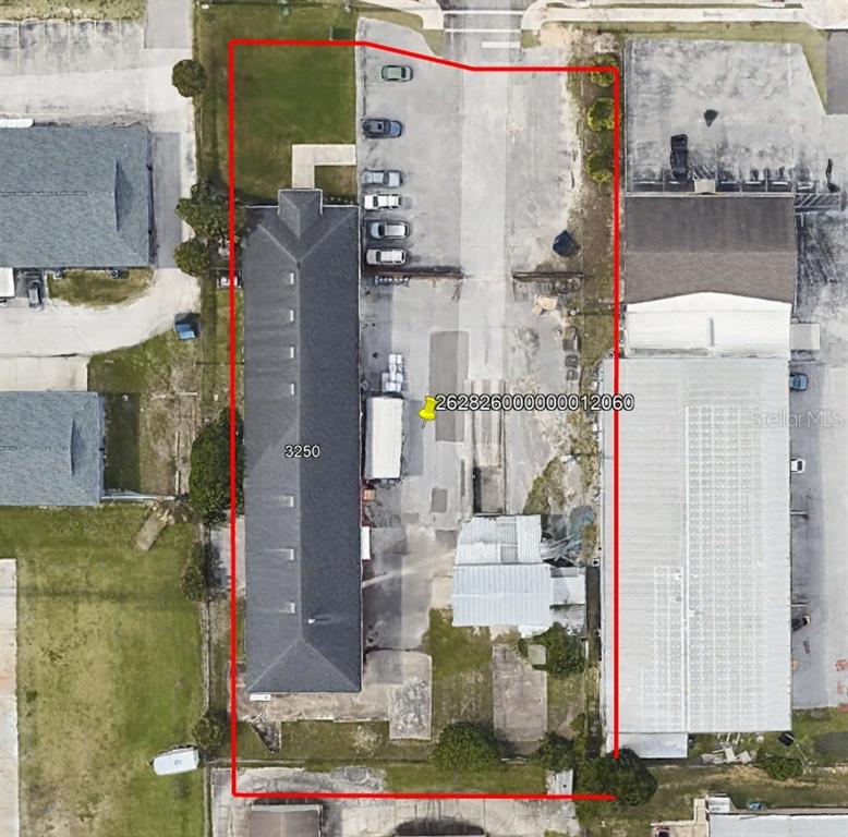 This aerial view shows a rectangular commercial property with a building and paved parking area — 3250 DUNDEE ROAD, WINTER HAVEN, FL