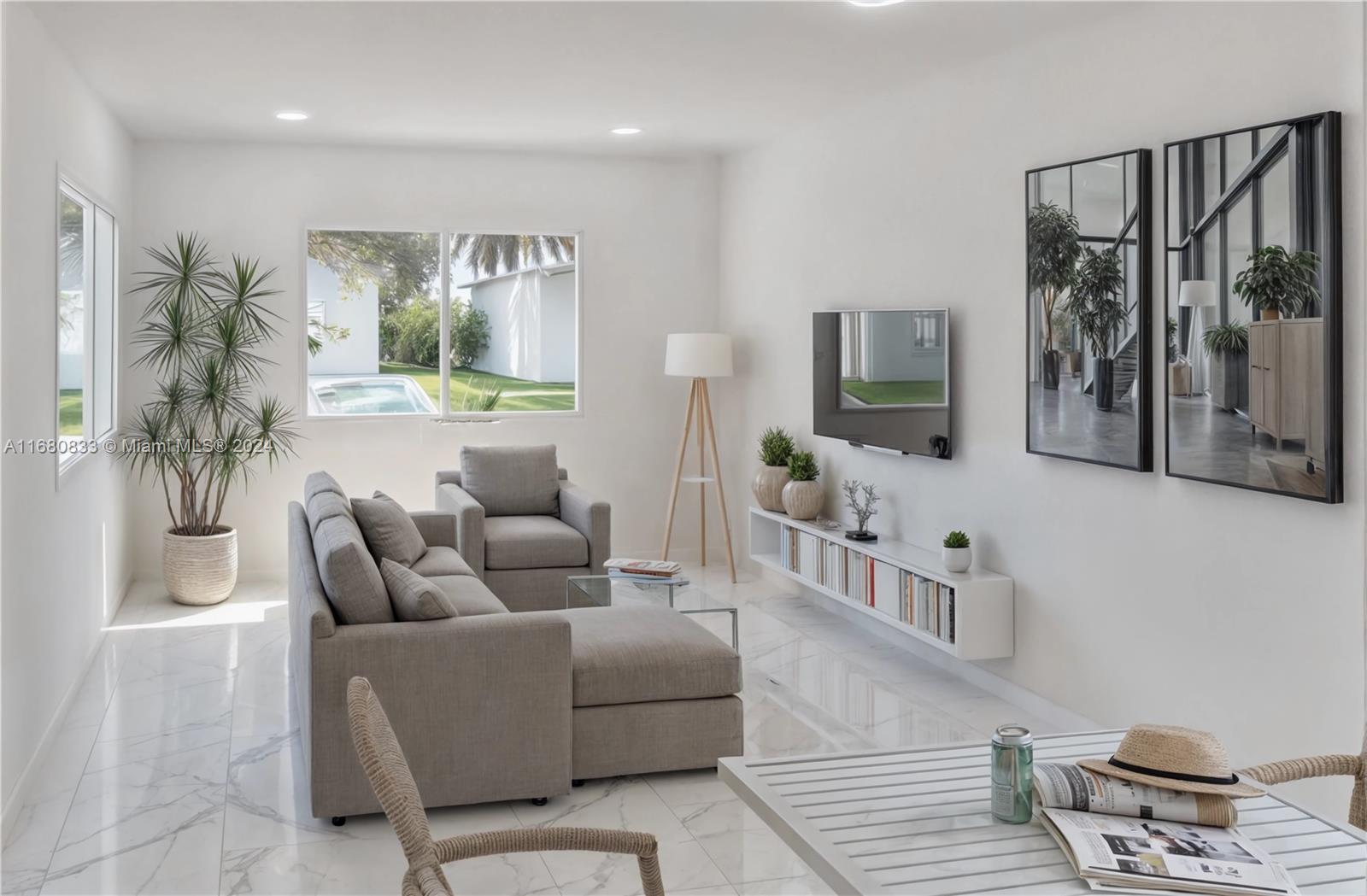 A bright living room features a grey sectional, floating media console, and marble-look tile flooring — 721 NW 5th Ave, Pompano Beach FL 33060, POMPANO BEACH, FL