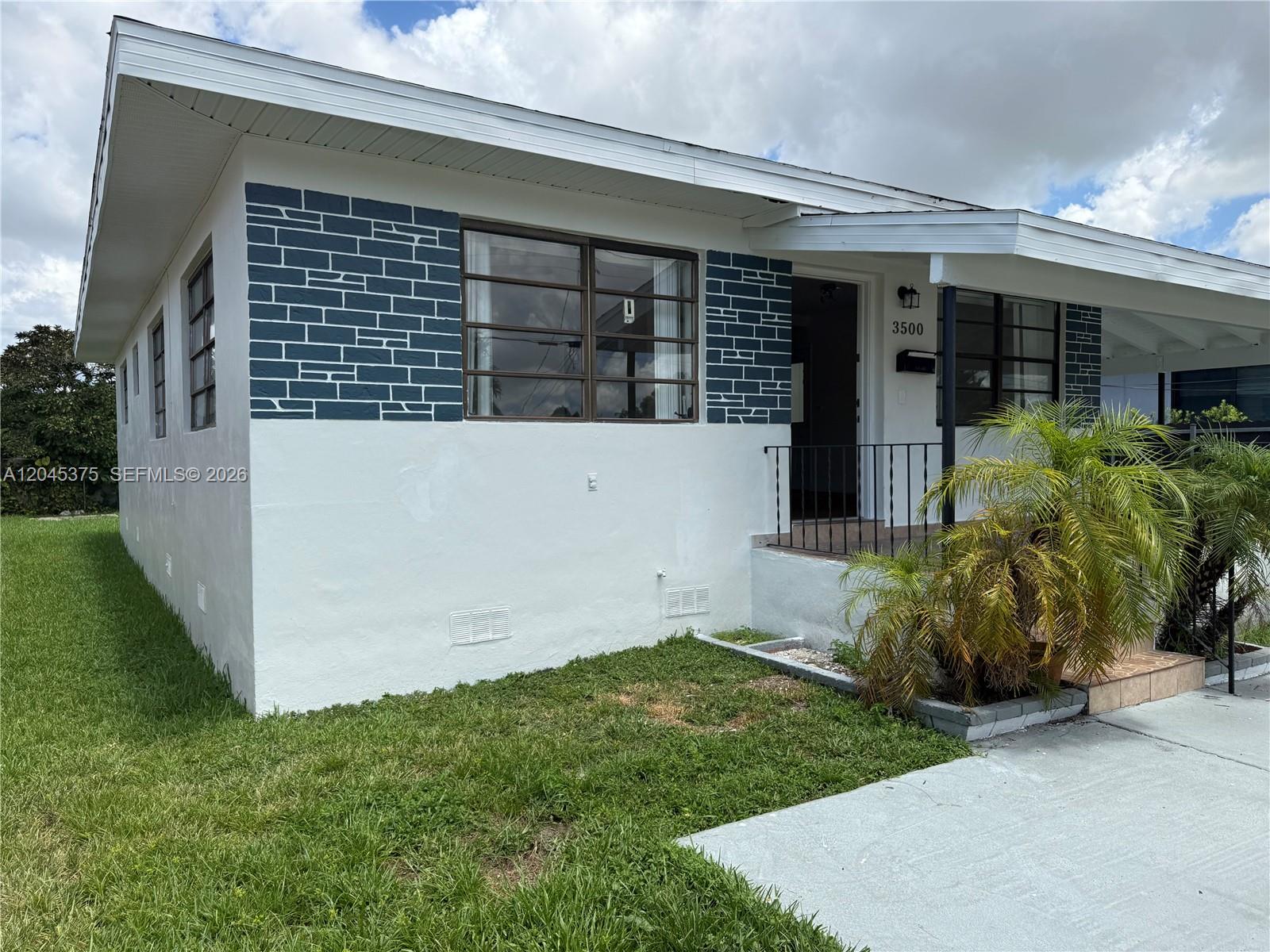 A single-story house features white stucco walls with blue brick-patterned accents and a front porch — 3500 SW 87th Pl # 3500, Miami FL 33165, MIAMI, FL