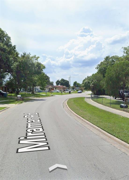 A view of a residential street named Miramar Road with houses and trees — 4668 MIRAMAR ROAD, ORLANDO, FL