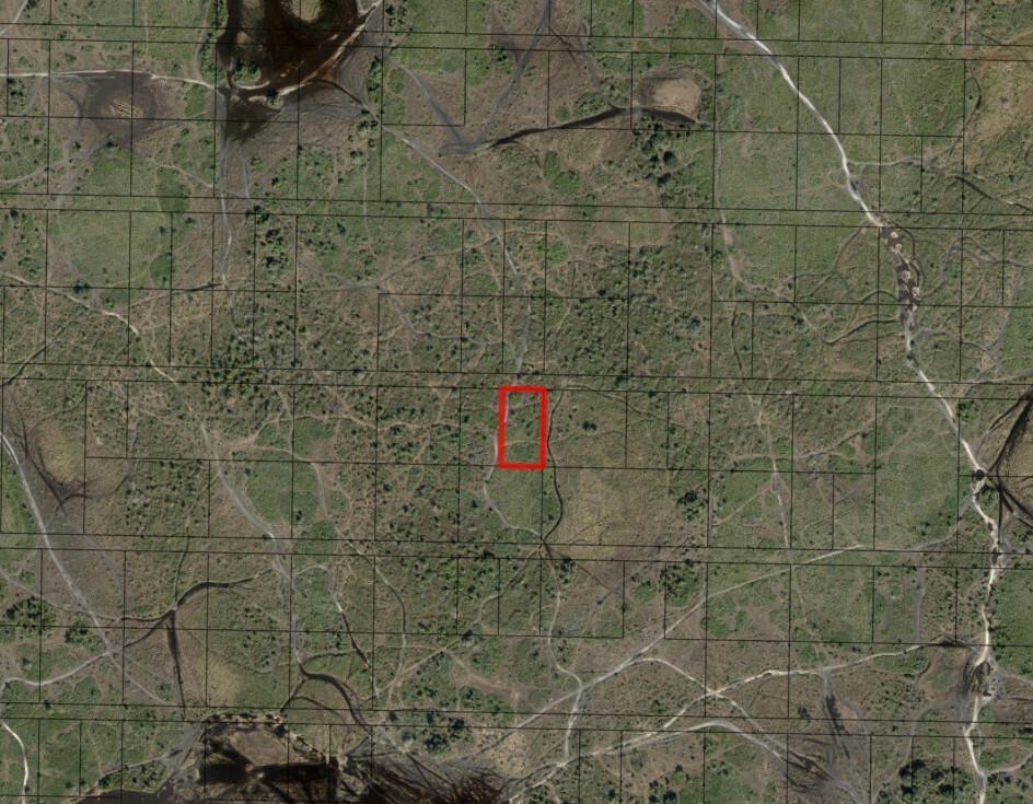 This is an aerial map showing a rectangular property parcel highlighted in red — 0 NW 312th Street, Okeechobee FL 34972, OKEECHOBEE, FL