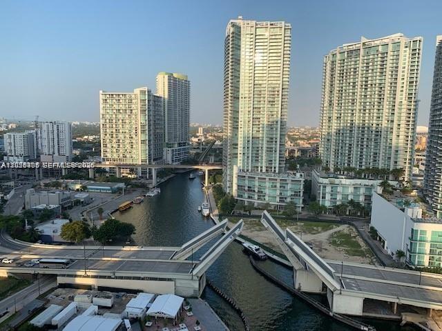 An elevated view of a city skyline with a drawbridge open over a canal — 31 SE 5th St # 705, Miami FL 33131, MIAMI, FL