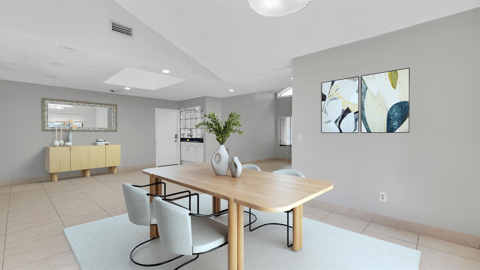 A dining area features a light wood table, four chairs, and a sideboard on tile — 7659 Sierra Terrace W, Boca Raton FL 33433, BOCA RATON, FL