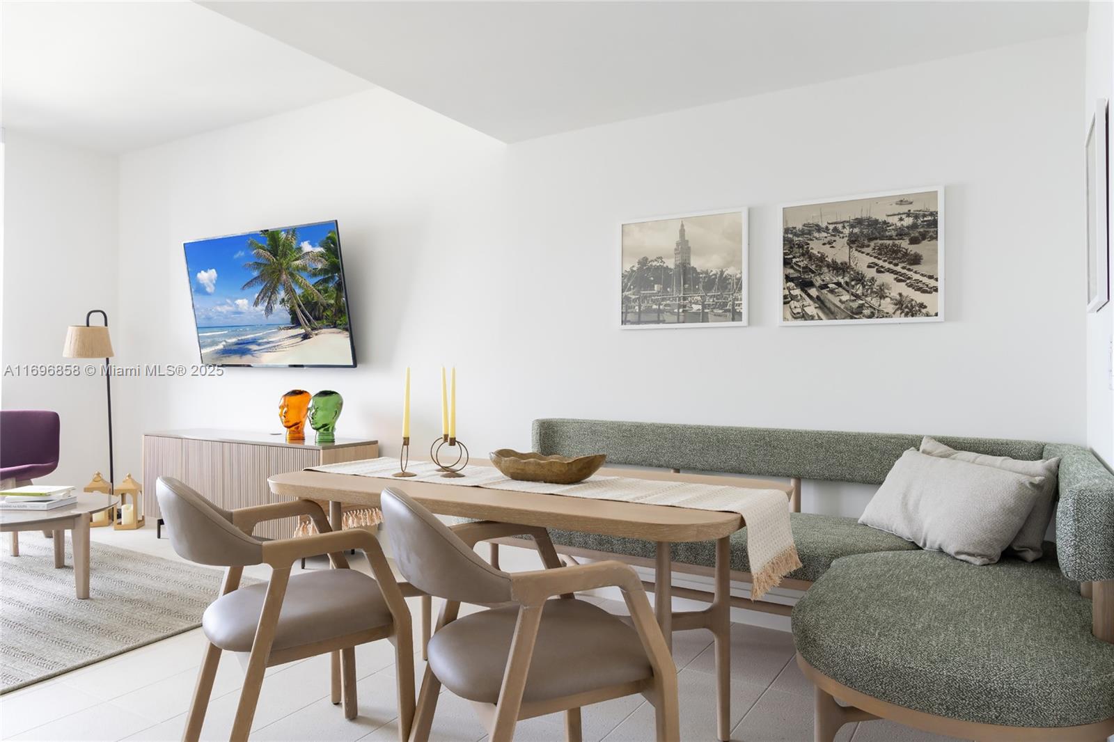 A dining area features a wooden table, chairs, and a green upholstered corner bench — 159 NE 6TH ST # 4513, Miami FL 33132, MIAMI, FL
