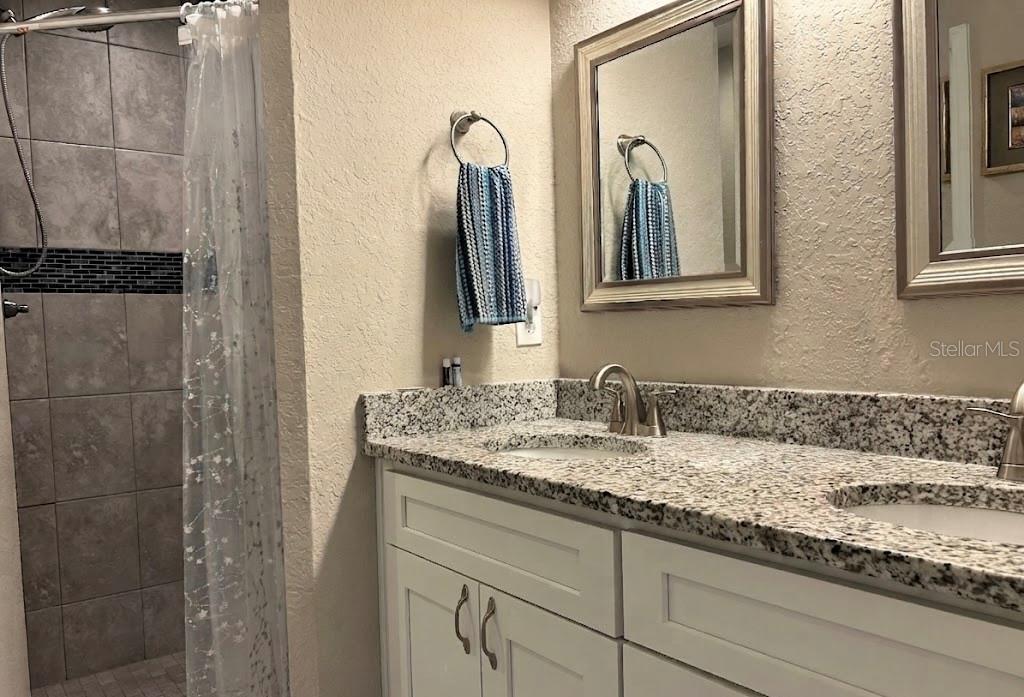 A bedroom features a wooden headboard, a white dresser, and light-colored curtains over a window — 2632 SW 175TH LOOP, OCALA, FL