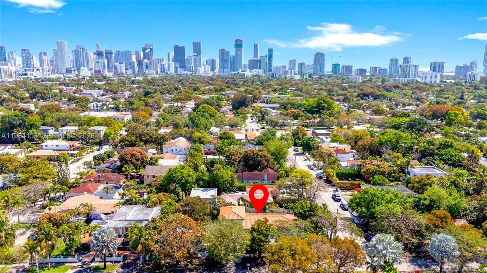 An aerial view shows a residential neighborhood with a red-roofed house marked by a pin — 1345 SW 14th Ave, Miami FL 33145, MIAMI, FL