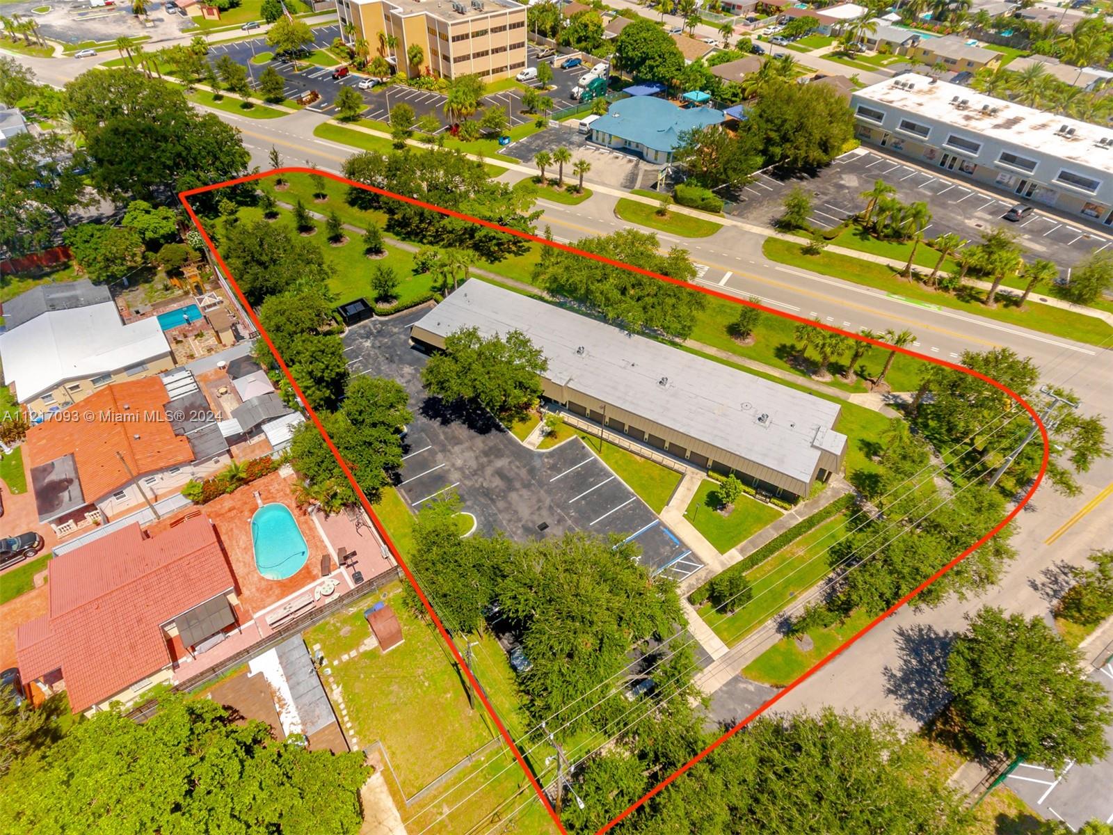 An aerial view shows a commercial building with a parking lot outlined in red — 7700 Davie Road Ext, Hollywood FL 33024, HOLLYWOOD, FL