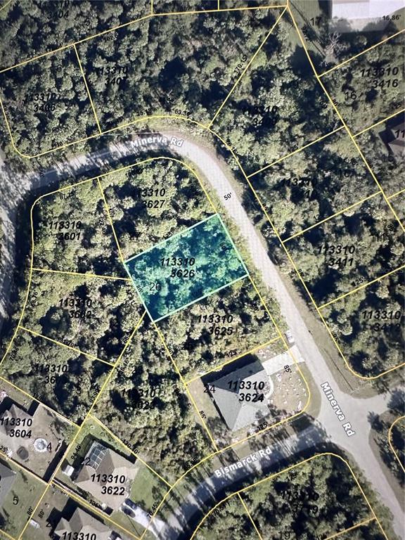 This is an aerial map showing a highlighted vacant lot located on a curved road — MINERVA ROAD, NORTH PORT, FL