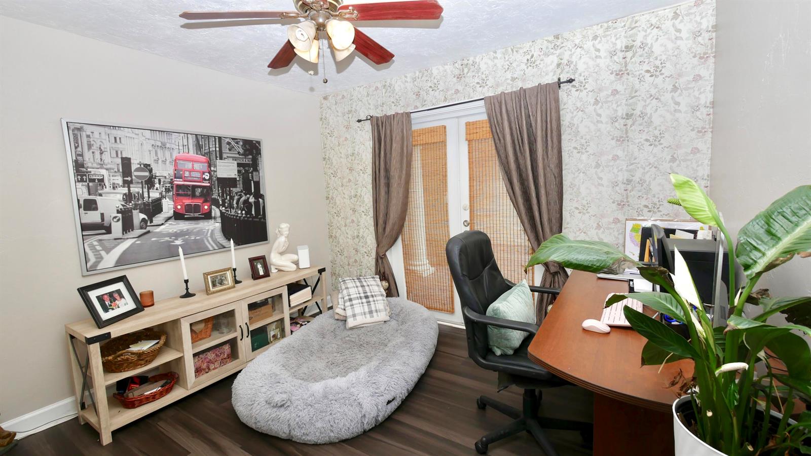 A home office features a desk, a large dog bed, and a London-themed wall print — 5191 SW 109th Avenue, Davie FL 33328, DAVIE, FL