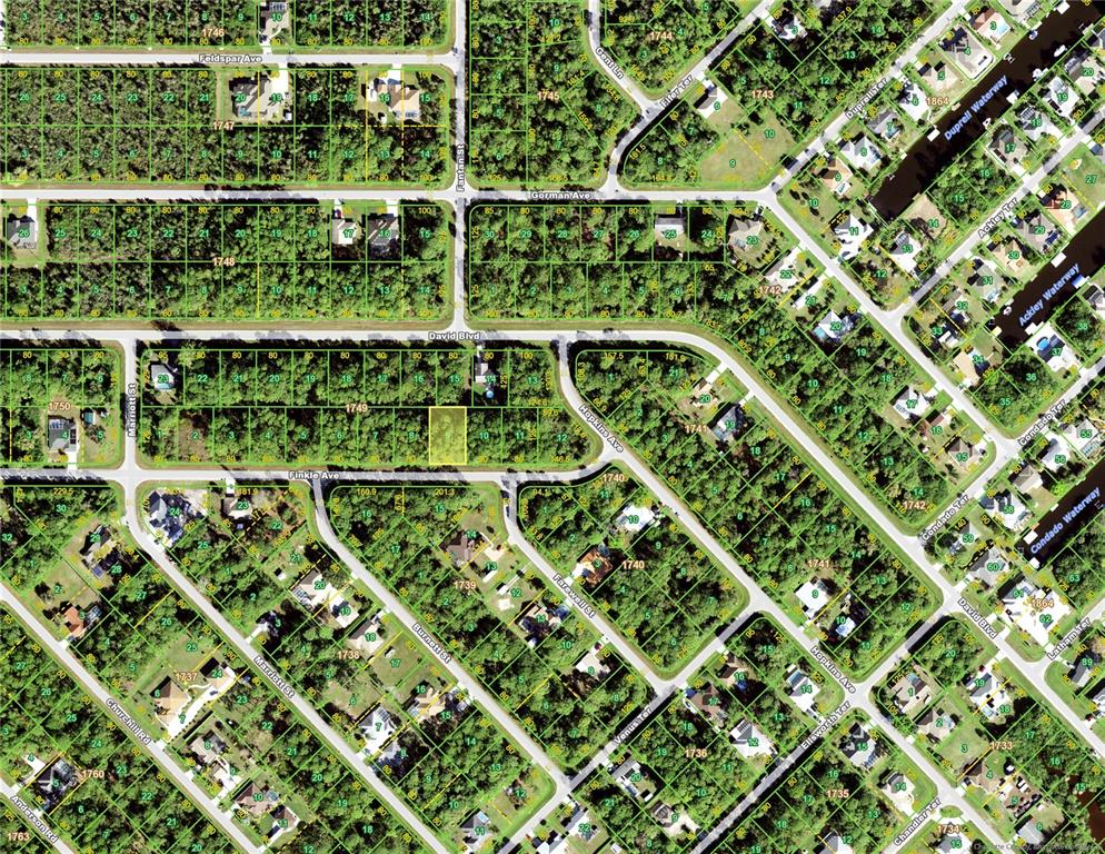 This is an aerial map showing residential lots, streets, and waterways in a suburban neighborhood — 13248 FINKLE AVENUE, PORT CHARLOTTE, FL