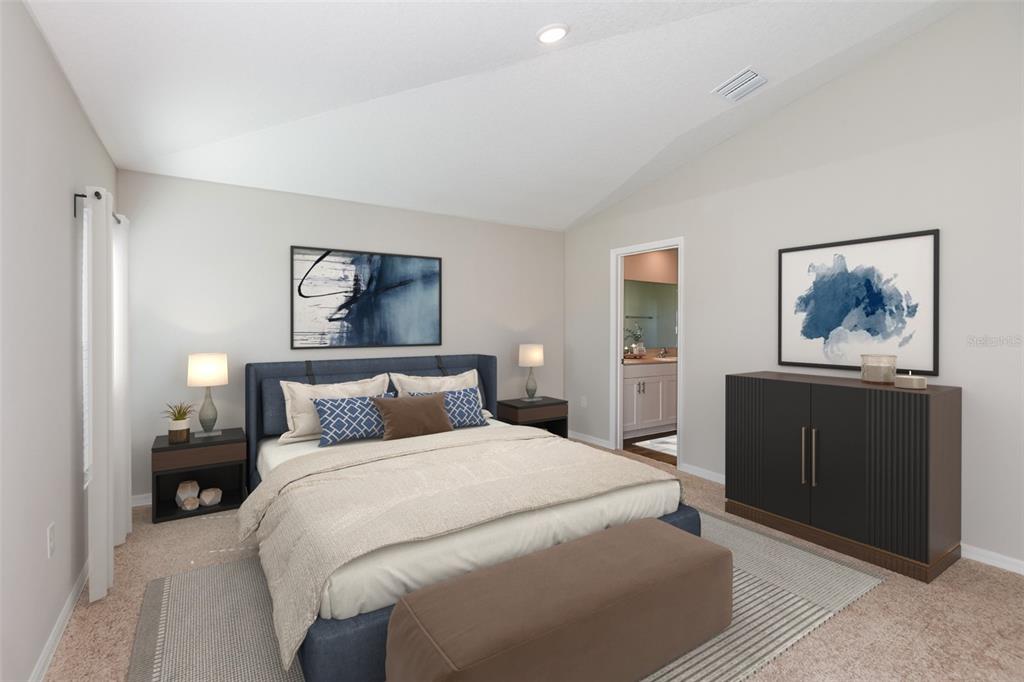 A bedroom features a blue upholstered bed, two nightstands, a dresser, and a bench — 1751 VANILLA STREET, HAINES CITY, FL