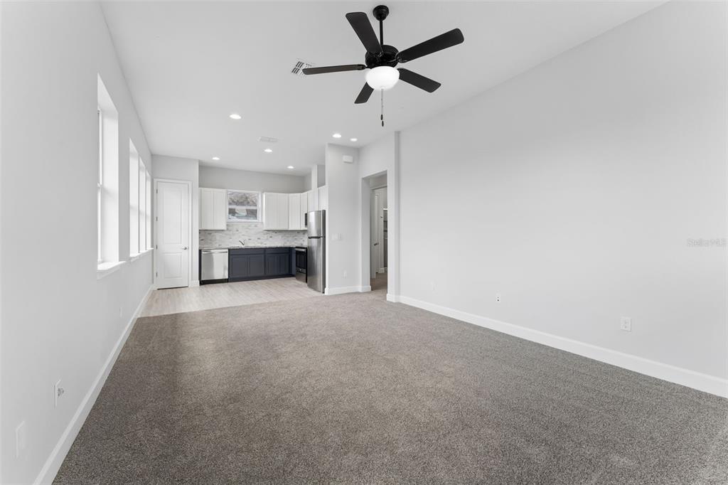 This is a floor plan showing a bedroom, bathroom, kitchen, living room, and stairs — 8033 NEMOURS PARKWAY, ORLANDO, FL