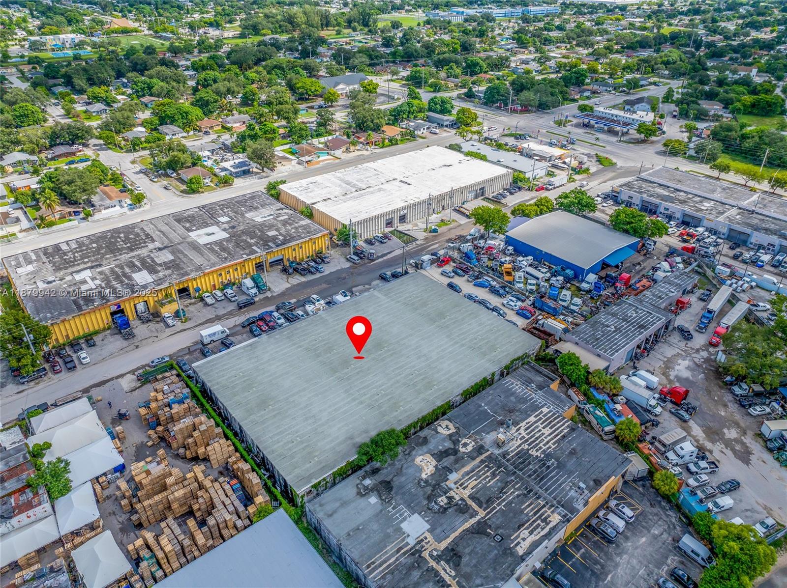An aerial view shows a large industrial warehouse building with a red location marker — 2310 NW 150th St, Opa-Locka FL 33054, OPA-LOCKA, FL