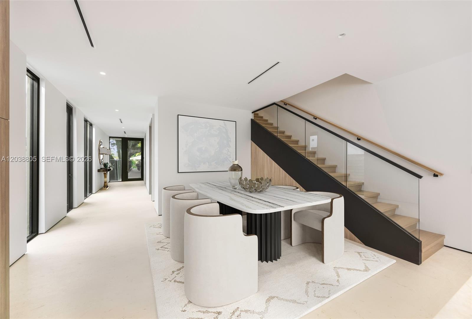 A modern dining area features a marble table, curved chairs, and a glass-railed staircase — 3144 Elizabeth St, Coconut Grove FL 33133, COCONUT GROVE, FL
