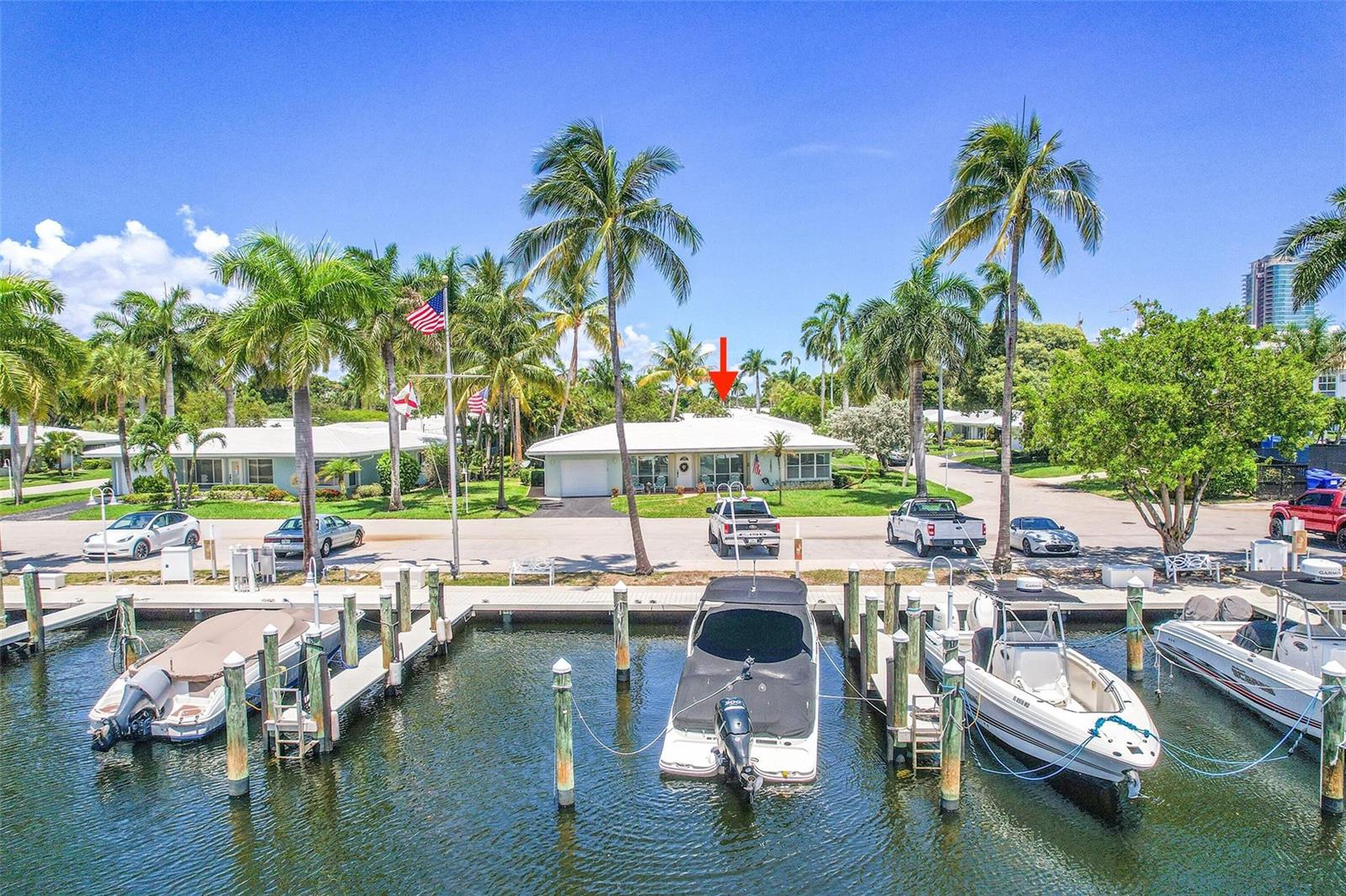 An aerial view shows a waterfront house with a boat dock and parked vehicles — 1431 S Ocean Boulevard # 74, Pompano Beach FL 33062, POMPANO BEACH, FL