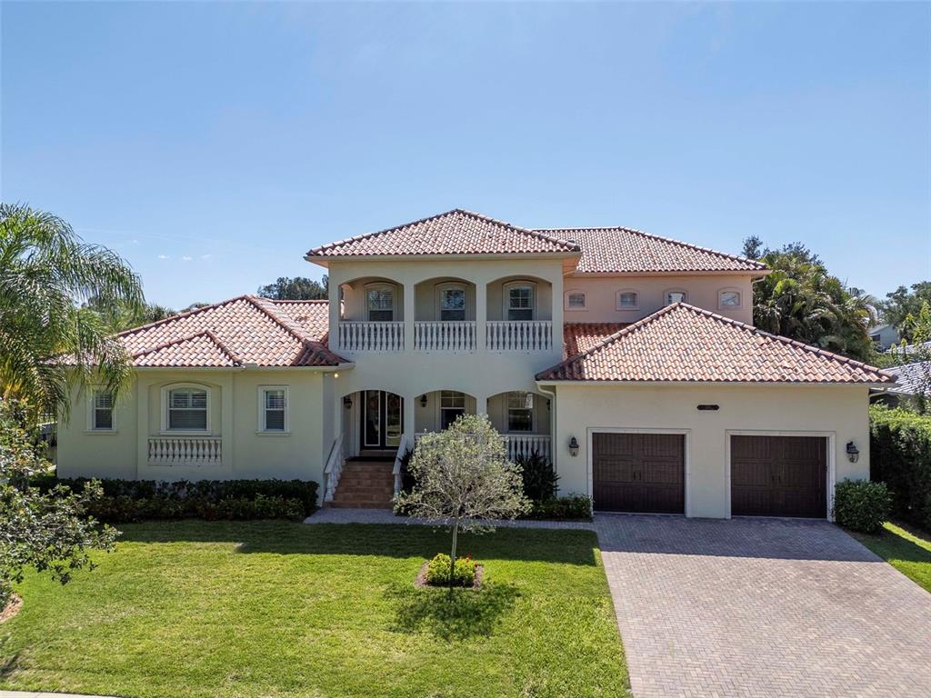 A two-story house with a tile roof, a balcony, and a two-car garage — 2212 S OCCIDENT STREET, TAMPA, FL
