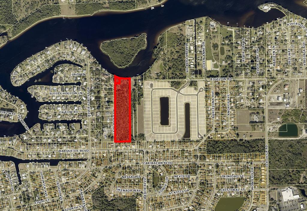 This is an aerial map showing a rectangular parcel of land highlighted in red — 2330 & 2318 LAZY RIVER LANE, FORT MYERS, FL