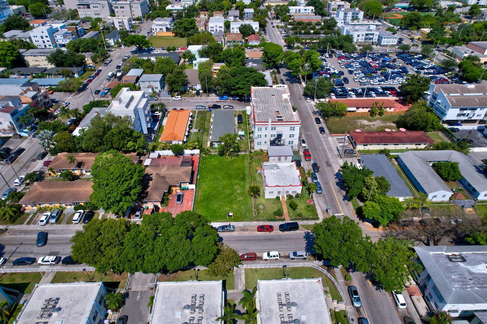 An aerial view shows a vacant lot situated between residential buildings and a street — 512 SW 6th Avenue, Miami FL 33130, MIAMI, FL