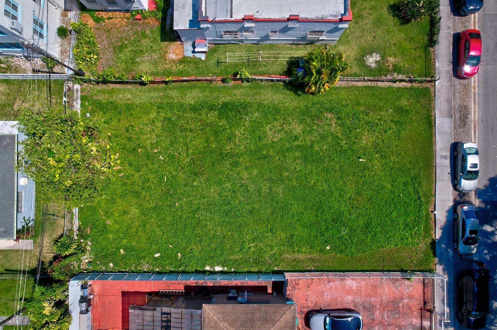 An aerial view shows a rectangular vacant grass lot situated between two residential buildings — 512 SW 6th Avenue, Miami FL 33130, MIAMI, FL