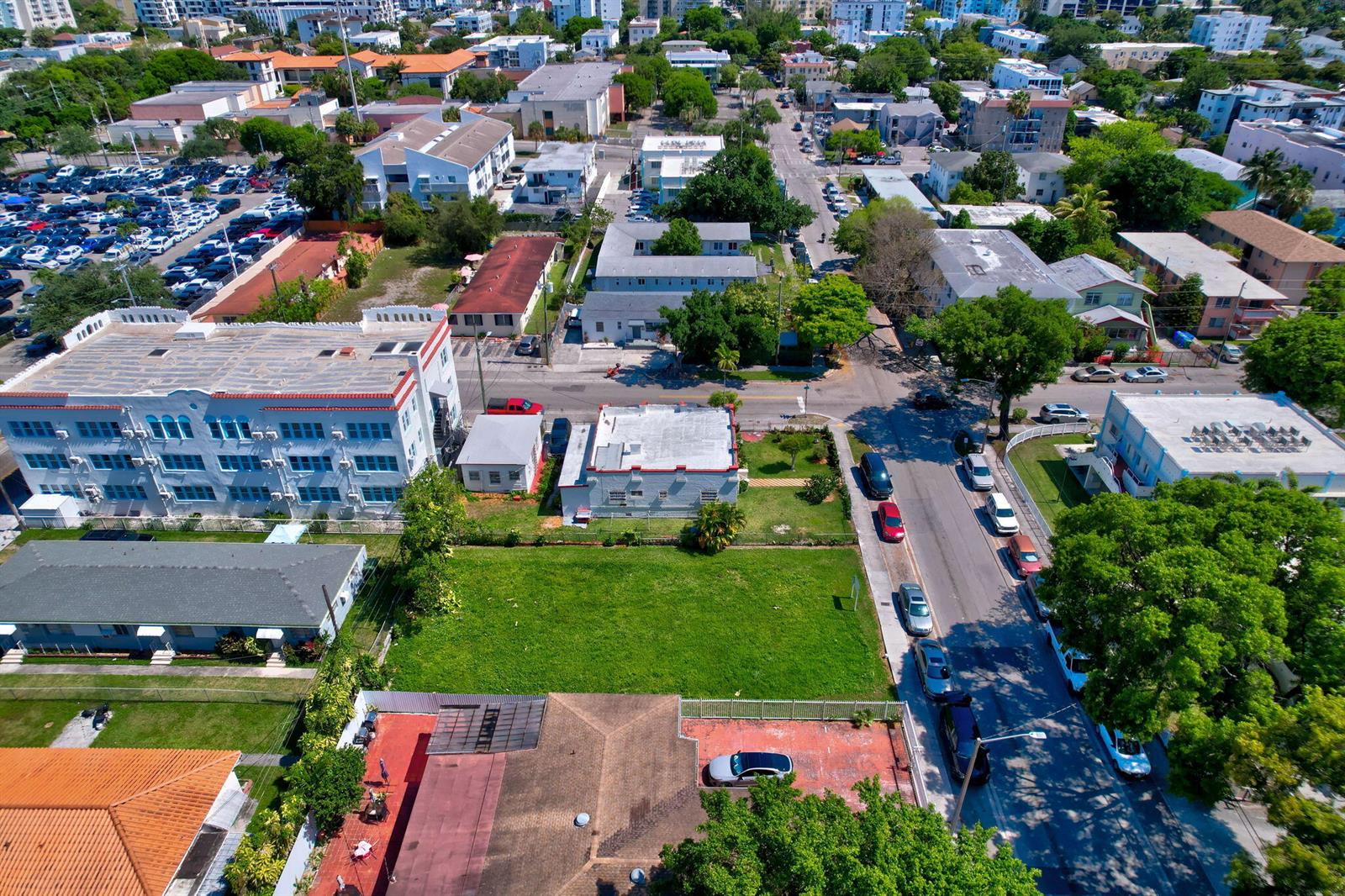 An aerial view shows a vacant grassy lot surrounded by residential and commercial buildings — 512 SW 6th Avenue, Miami FL 33130, MIAMI, FL