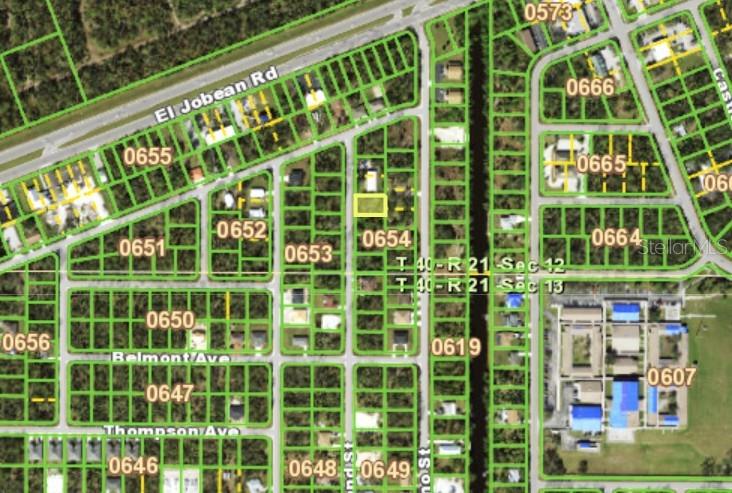This is a map showing a residential lot highlighted in yellow within a neighborhood grid — 1974 REDMOND STREET, PORT CHARLOTTE, FL
