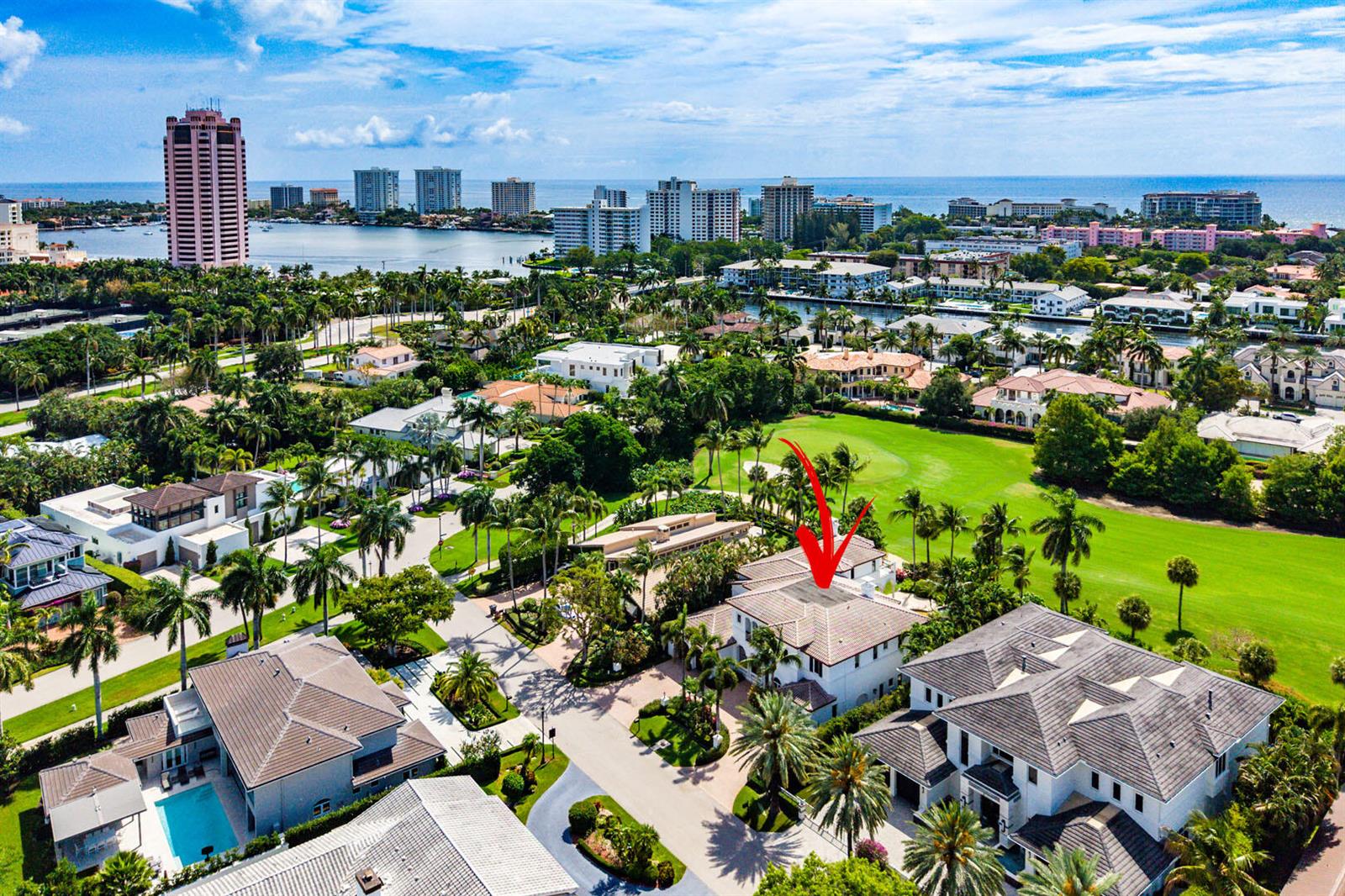 An aerial view of a residential neighborhood with a red arrow pointing to a house — 1282 Sabal Palm Drive, Boca Raton FL 33432, BOCA RATON, FL