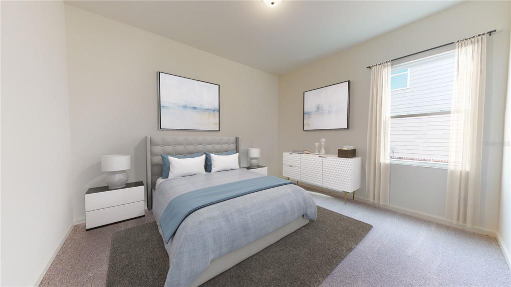 A bedroom features a bed with blue bedding, two framed artworks, and a white dresser — 13256 BENDING CREEK TRAIL, PARRISH, FL
