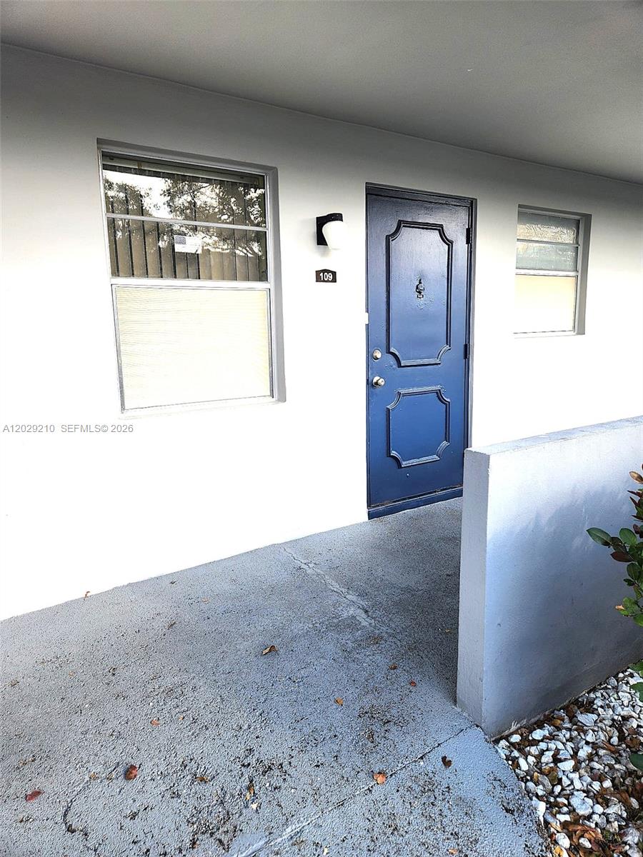 The exterior view shows a blue front door labeled 109 next to two windows — 7787 Golf Circle Drive # 109, Margate FL 33063, MARGATE, FL