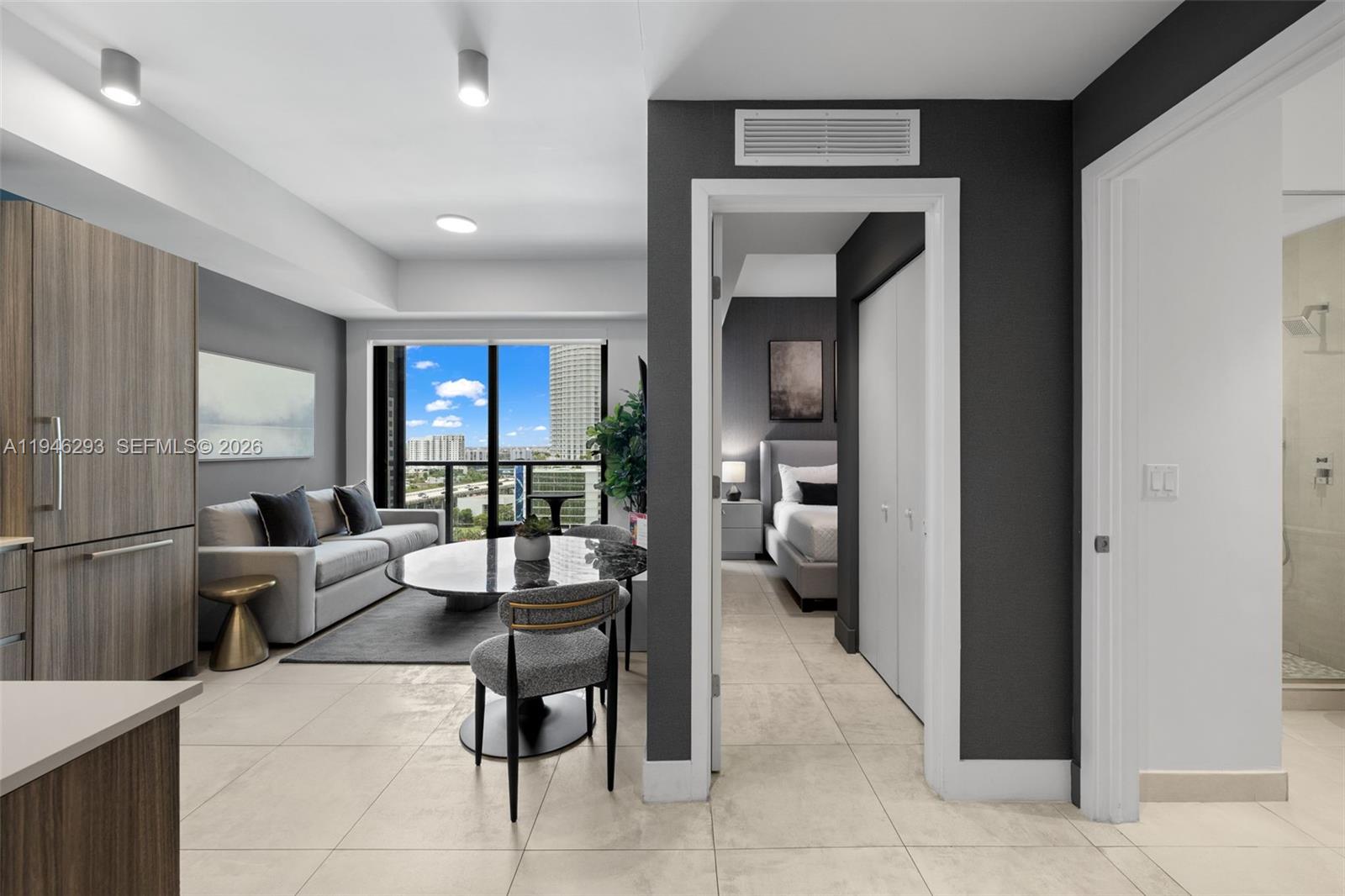 A modern apartment interior features a living area, dining space, and bedroom with tile floors — 239 SW 9th St # 1604, Miami FL 33130, MIAMI, FL