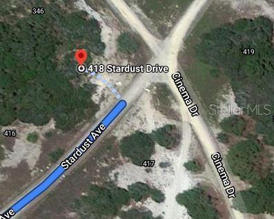 This is a satellite map view showing a vacant lot at a road intersection — 418 STARDUST DRIVE, LAKE PLACID, FL