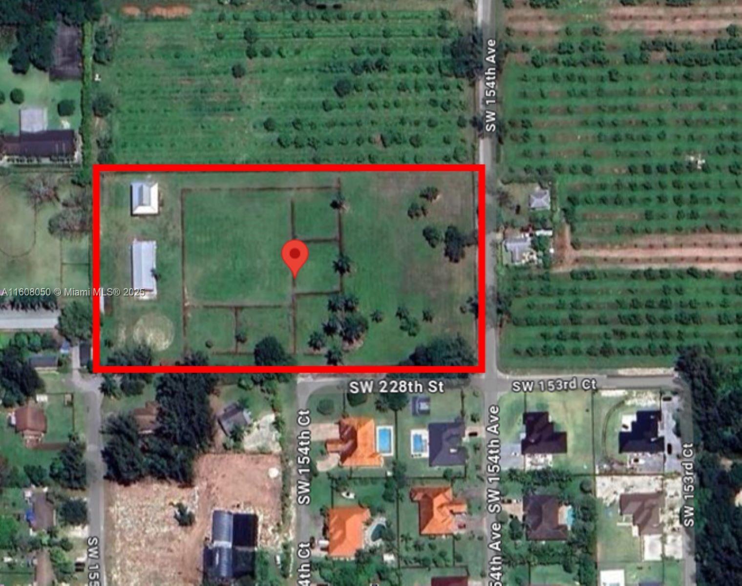 This aerial map shows a rectangular plot of land with two buildings and fenced sections — 22750 SW 154th ave, Miami FL 33170, MIAMI, FL
