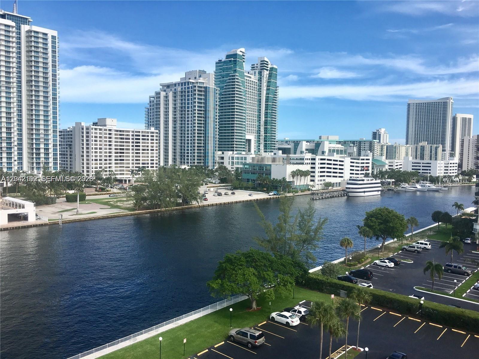An elevated view shows a canal flowing between high-rise buildings and parking lots — 800 Parkview Dr # 1018, Hallandale Beach FL 33009, HALLANDALE BEACH, FL
