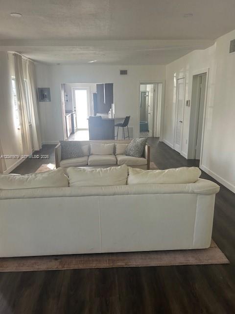 A living room with a white sofa faces a second sofa and an open kitchen — 1785 Calais Dr # 5, Miami Beach FL 33141, MIAMI BEACH, FL