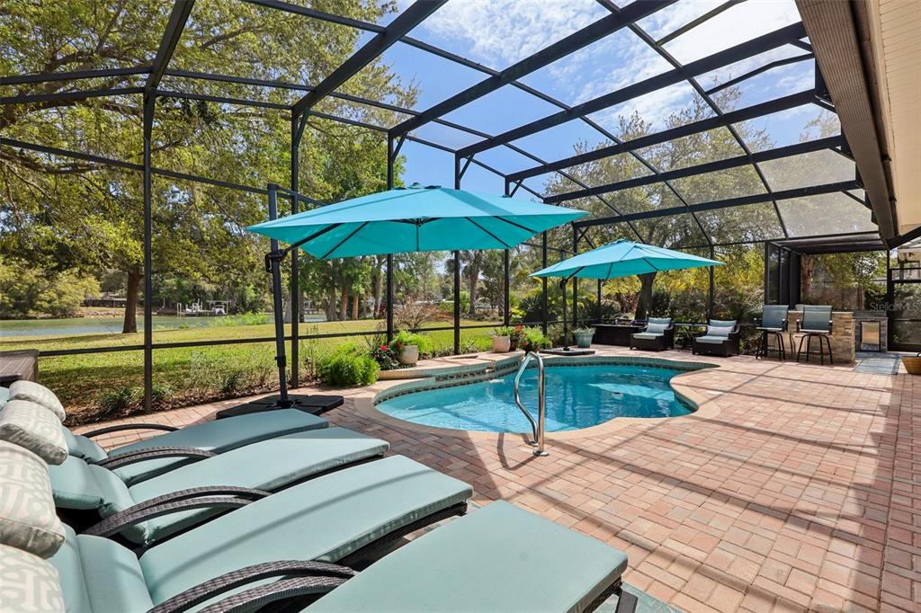 A single-story house with a paved driveway, tan stucco exterior, and a tiled roof — 101 LONGVIEW WAY N, PALM COAST, FL