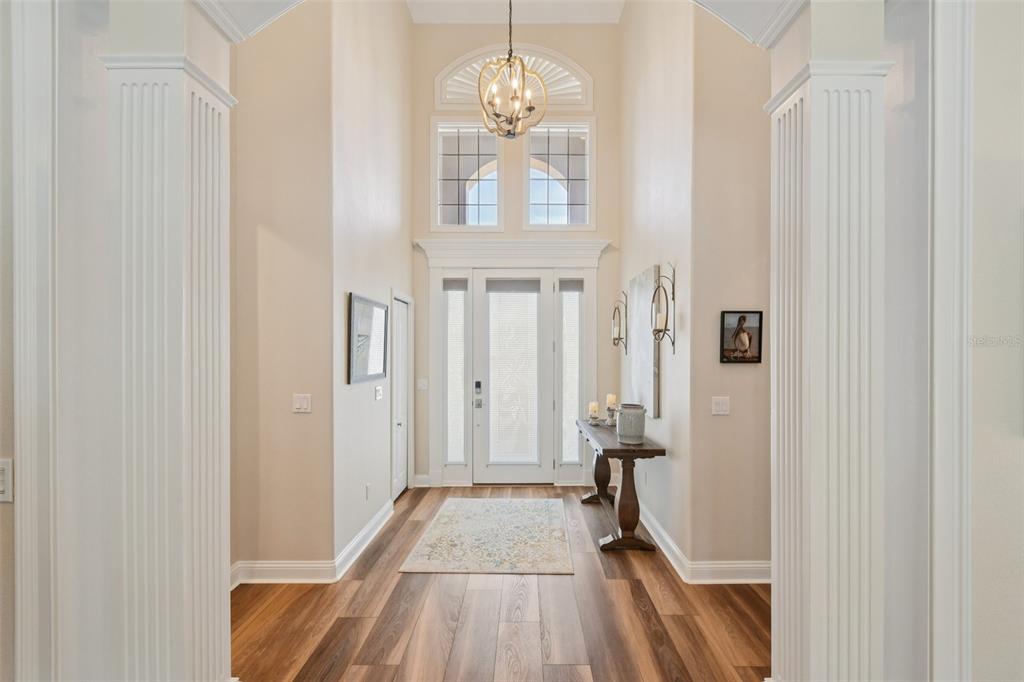 A single-story house with a beige stucco exterior, a paver driveway, and a tiled roof — 101 LONGVIEW WAY N, PALM COAST, FL