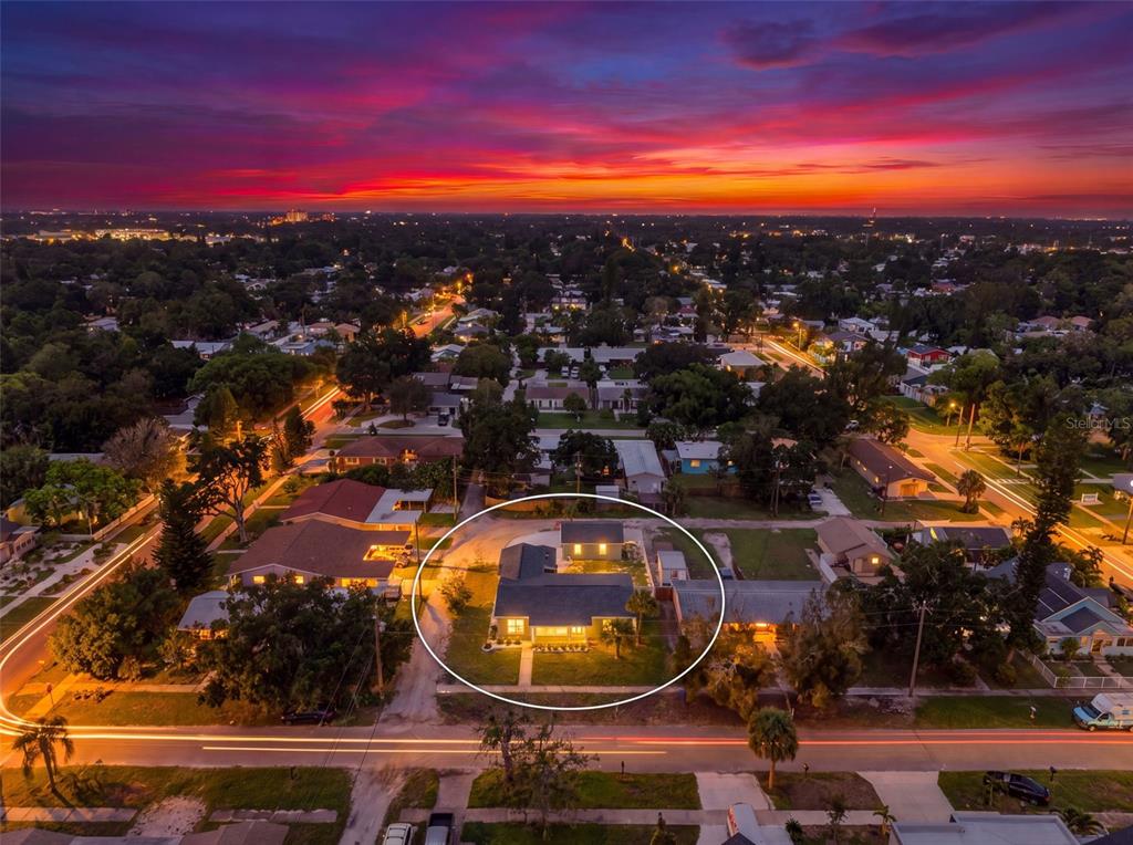 An aerial view of a residential house at sunset with a white circle highlighting it — 5217 18TH AVENUE S, GULFPORT, FL