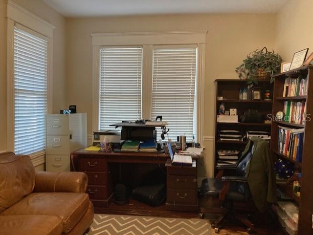 A home office features a wooden desk, a leather sofa, and a tall bookshelf — 806 W DE LEON STREET, TAMPA, FL