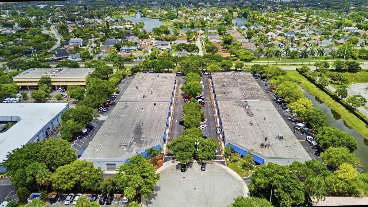 An aerial view of two parallel commercial buildings with flat roofs and surrounding parking lots — 10002 NW 46th Street # 10002, Sunrise FL 33351, SUNRISE, FL