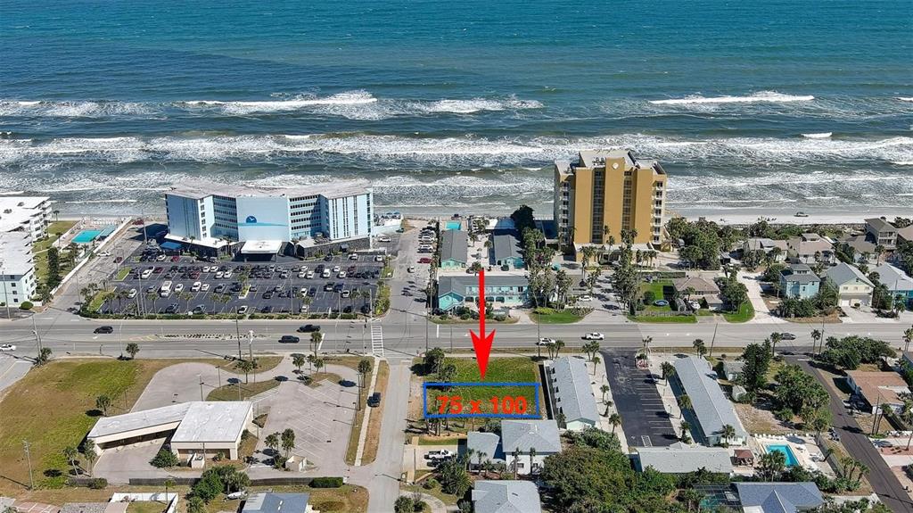 An aerial view shows a rectangular vacant lot marked with a blue outline near the ocean — 839 E 7TH STREET, NEW SMYRNA BEACH, FL