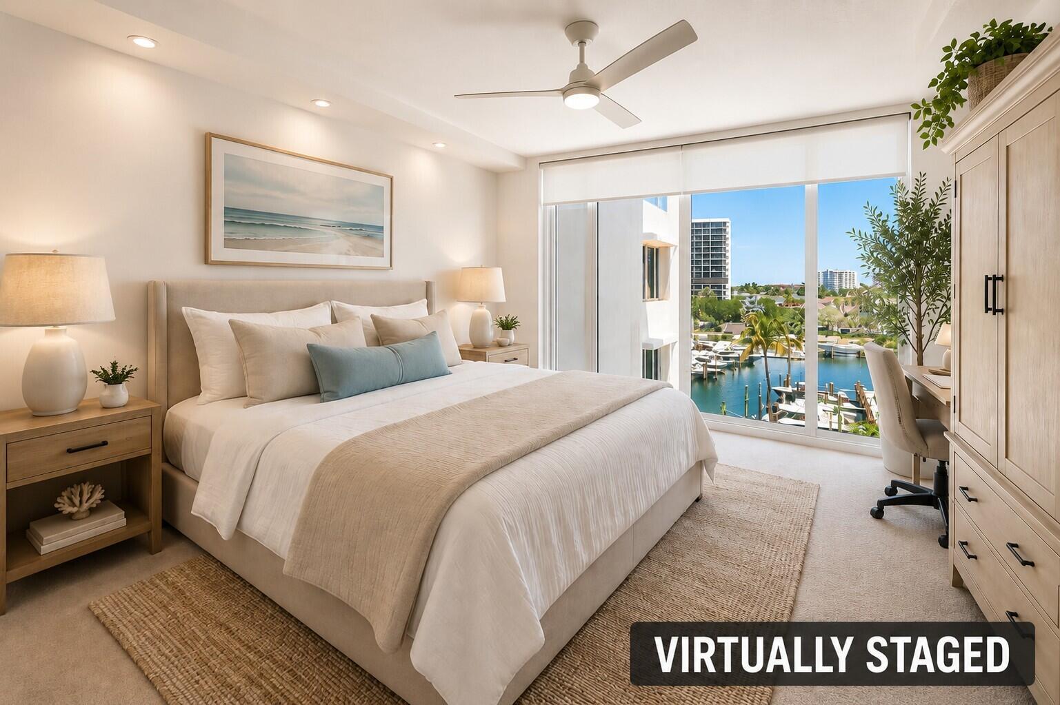 A bedroom features a bed, nightstands, a desk, and a window view of a marina — 4750 S Ocean Boulevard # 512, Highland Beach FL 33487, HIGHLAND BEACH, FL