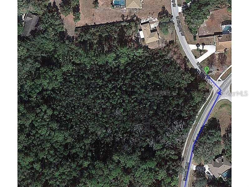 This is an aerial map view showing a wooded lot near a road intersection — 420 KINGWAY DRIVE, DELTONA, FL