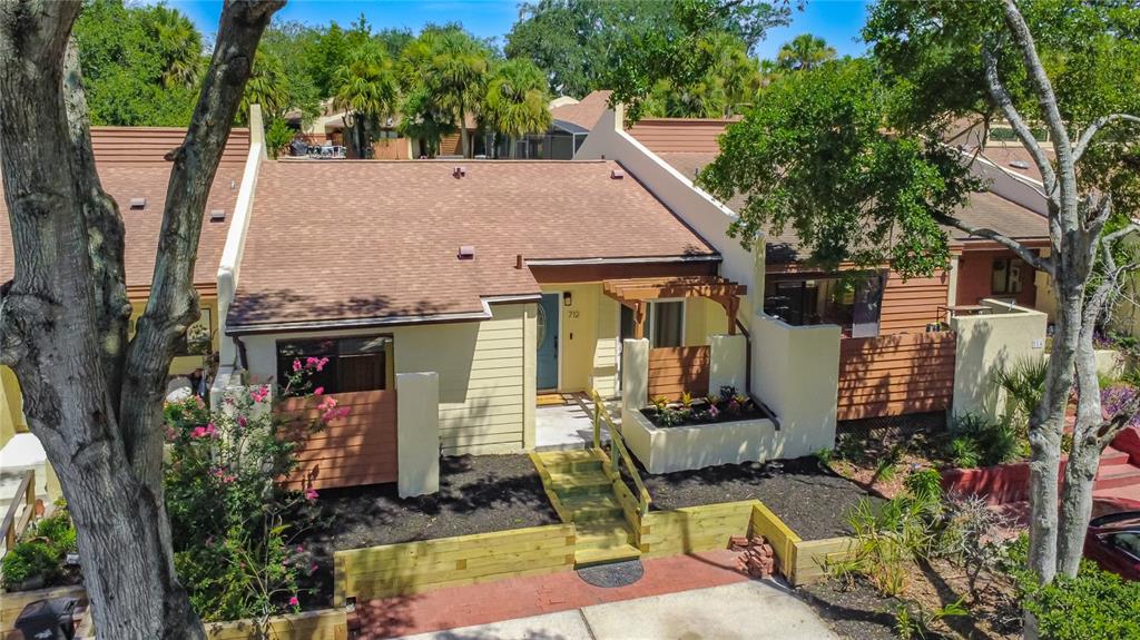An aerial view of a single-story townhouse with a brown roof and wooden steps — 712 TEAL LANE, ALTAMONTE SPRINGS, FL