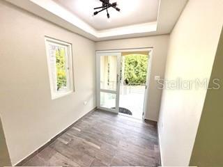 A small room with wood-look tile flooring, a ceiling light, and a glass sliding door — 56 HARBOUR LIGHTS ESTATES EXTENSION UNIT 56, HUMACAO, PR