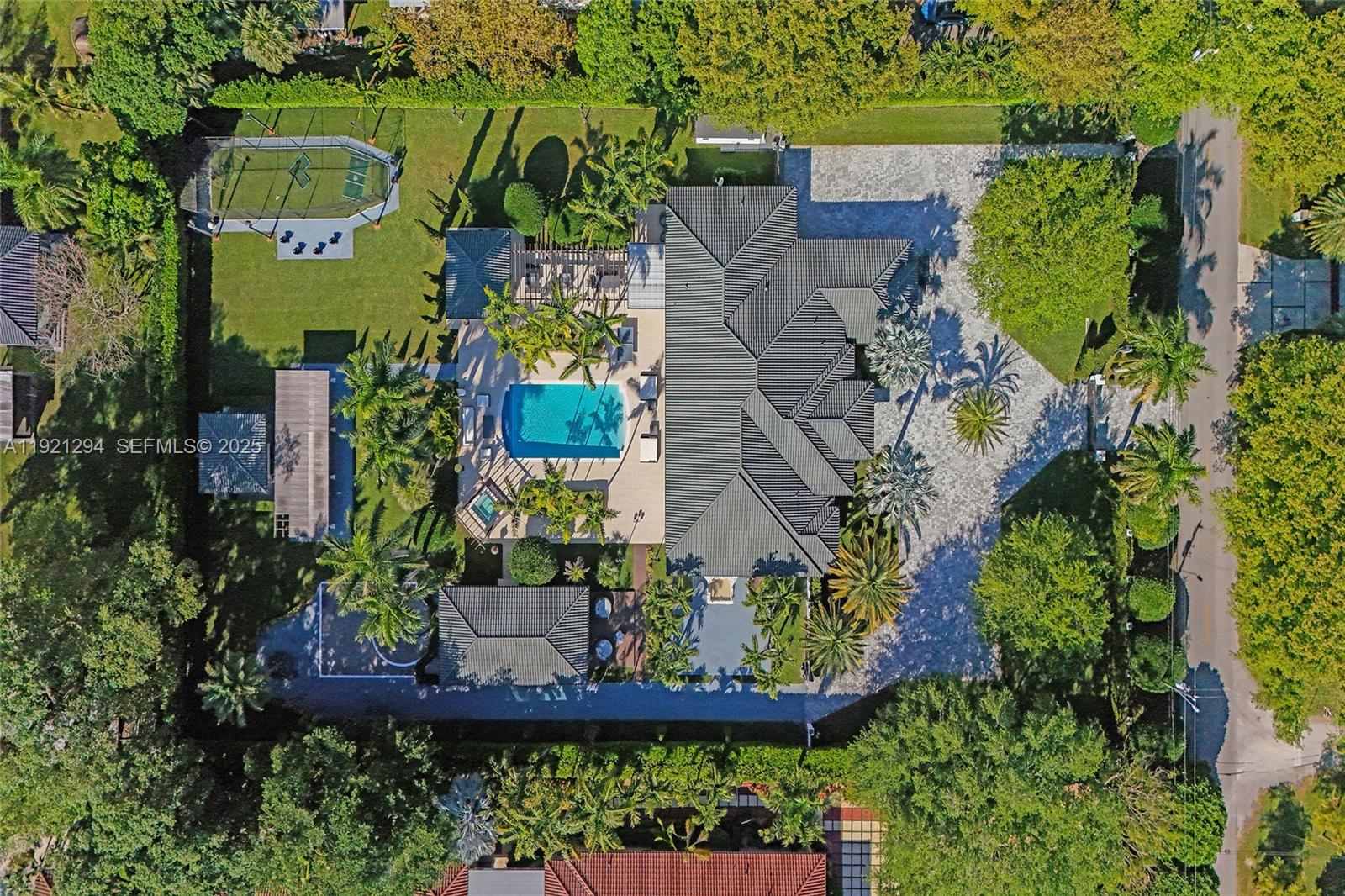 An aerial view shows a large house with a pool, tennis court, and paved driveway — 10400 SW 62nd St, Miami FL 33173, MIAMI, FL