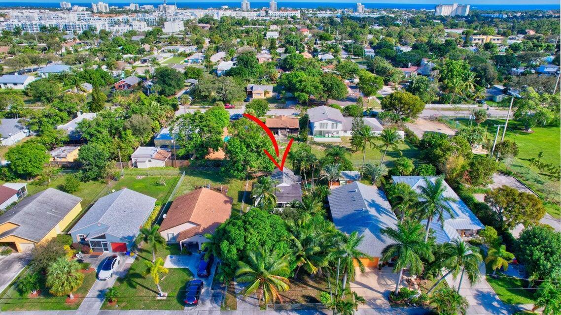 An aerial view shows a residential neighborhood with a red arrow pointing to a house — 237 SW 3rd Avenue, Delray Beach FL 33444, DELRAY BEACH, FL