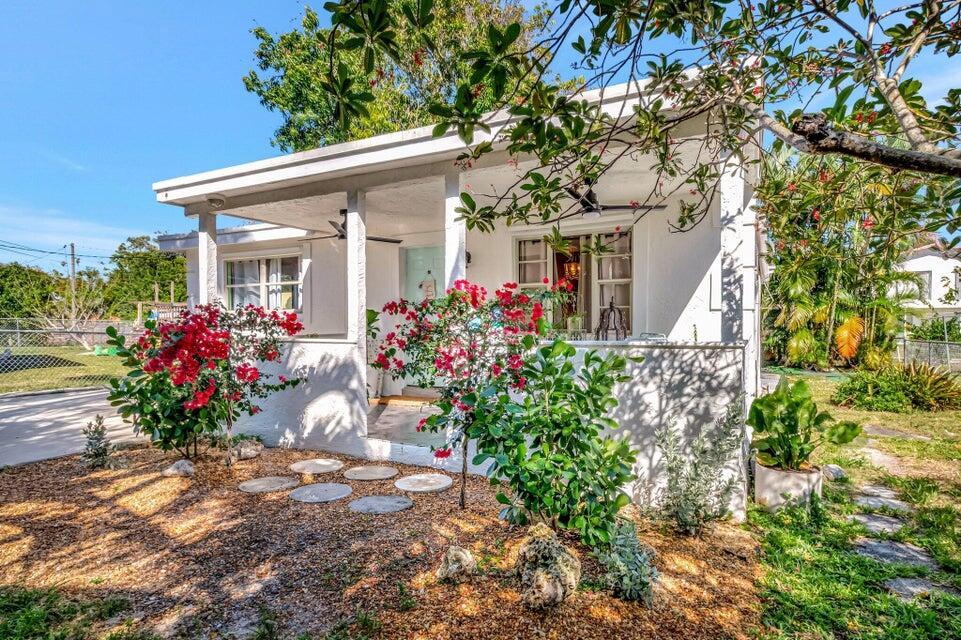 A white cottage with a covered front porch, bougainvillea bushes, and a stone walkway — 237 SW 3rd Avenue, Delray Beach FL 33444, DELRAY BEACH, FL