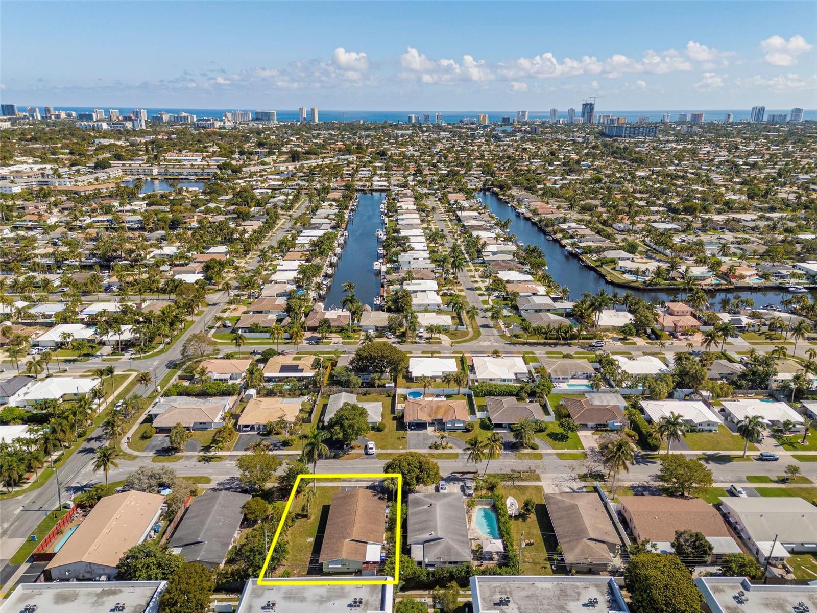 An aerial view shows a single-story house with a yellow outline in a residential neighborhood — 321 SE 1st Avenue, Pompano Beach FL 33060, POMPANO BEACH, FL