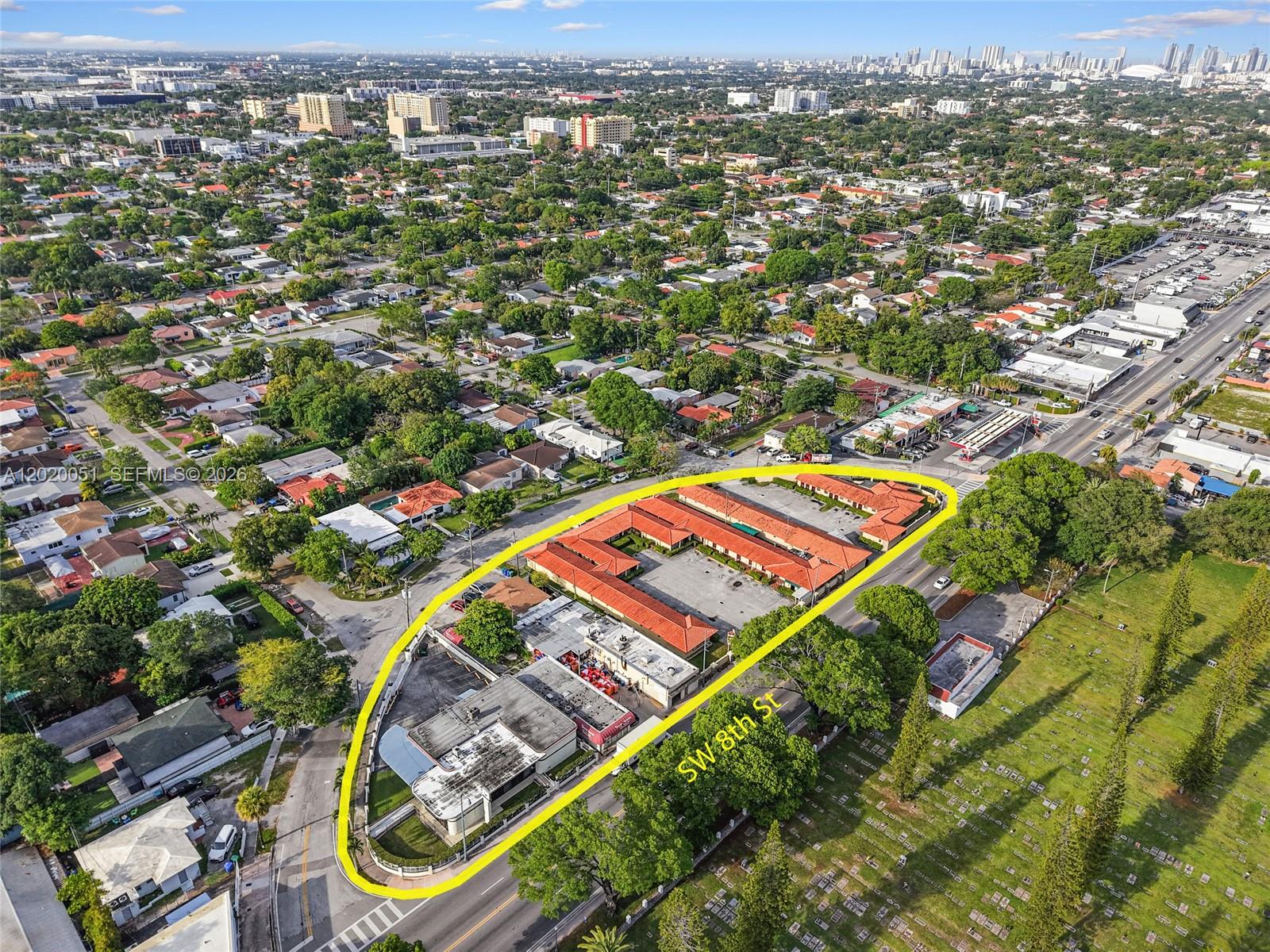 An aerial view shows a commercial property with a parking lot and buildings — 4445 SW 8th St, Miami FL 33134, MIAMI, FL