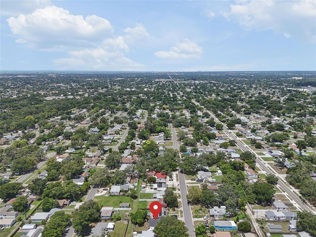 An aerial view shows a residential neighborhood with a red map pin marking a house — 4924 45TH AVENUE N, ST PETERSBURG, FL