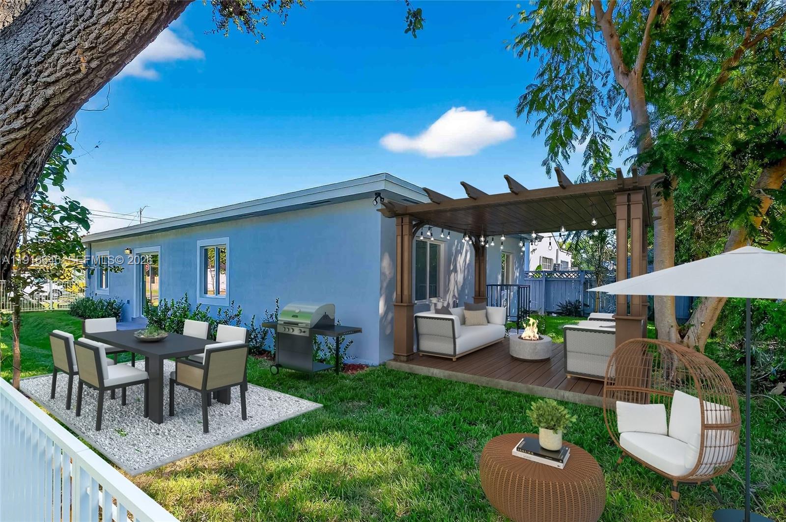 A backyard features a patio with a pergola, outdoor seating, a fire pit, and dining area — 1346 NW 44th St, Miami FL 33142, MIAMI, FL